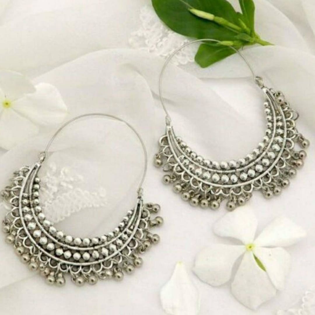 Beautiful silver-plated Jhumka earrings with intricate floral, triangular,  and circular designs. – Rigouts – Remembering the roots.
